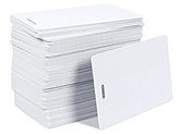 OrsonLew.com photo of a stack of blank white PVC cards with a slot punch on the short side that may be used for vertical ID badges